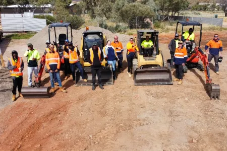 students standing with machinery